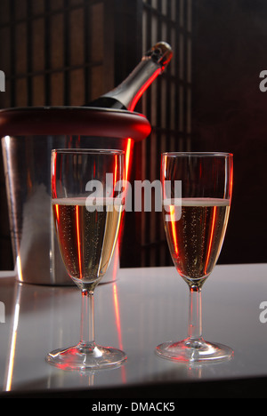 pouring champagne and fireworks on a dark background Stock Photo