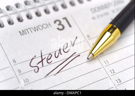 german tax day marked on calendar- tax in german: Steuer Stock Photo