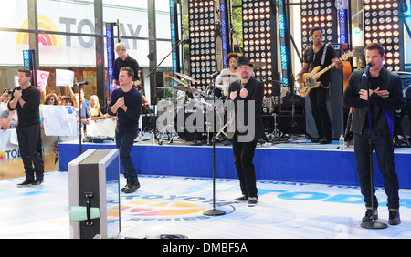 Jeff Timmons Drew Lachey Justin Jeffre and Nick Lachey 98 Degrees re-unite to perform live at Rockefeller Plaza as part of Stock Photo