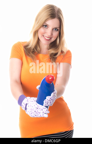 Young Woman or Housewife Wearing Protective Gloves Holding A Bottle of Cleaning Bleach To Sanitise Household Appliances Such As Toilets and Sinks Stock Photo