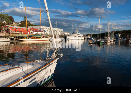 sailboats and powerboats tied up in the inner harbor of Camden Maine. Wayfarer Marine is in the background. Stock Photo