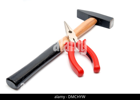 Tools collection - Hammer with wooden handle and flat-nose pliers with red handles isolated over white background Stock Photo