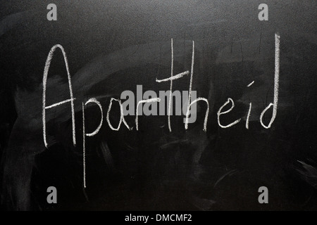 Apartheid drawn on a blackboard in white chalk. Stock Photo