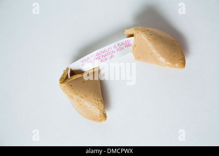 Fortune cookie on white background with fortune revealed Stock Photo