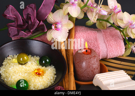 Spa accessories with orchid flowers on black background Stock Photo