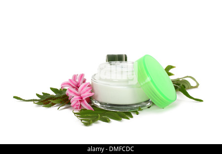 face cream with green leaves isolated on white background Stock Photo