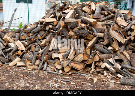 Traditional pile of chopped fire wood with a rustic rural look Stock Photo