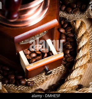 Coffee in grinder and rope still life Stock Photo