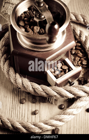 Coffee in grinder and rope still life Stock Photo