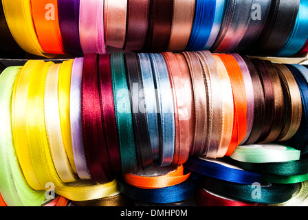 many-coloured ribbon spools in the craft Stock Photo