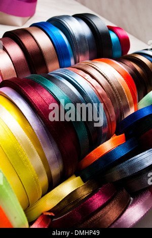 many-coloured ribbon spools in the craft Stock Photo