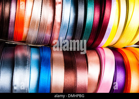 many-coloured ribbon spools in the craft Stock Photo