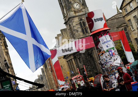The Saltire, the national flag of Scotland flies from a building on the Royal Mile in Edinburgh, Scotland. Stock Photo