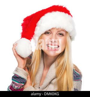 Portrait of smiling teenage girl in santa hat Stock Photo