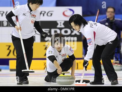 Fuessen, Germany. 14th Dec, 2013. Japanese curlers Michiko Tomabechi (L-R), Kaho Onodera and Yumie Funayama compete against China during the Olympic qualification at Arena Fuessen in Fuessen, Germany, 14 December 2013. Photo: Karl-Josef Hildenbrand/dpa/Alamy Live News Stock Photo