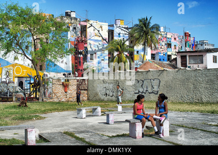 SCHOOLYARD AT LA ESCUELA DESSAU MARTIRES DEL HUMBOLDT, PAINTED WALLS IN THE CITY, LA SANTERIA PAINTINGS (CUBAN SYNCRETISM, AFRO-CARIBBEAN CULTURE), PICTORIAL WORKS BY SALVADOR GONZALEZ ESCALONA PAINTED ON THE CITY'S WALLS, CALLEJON DE HAMEL, HAVANA, CUBA, Stock Photo