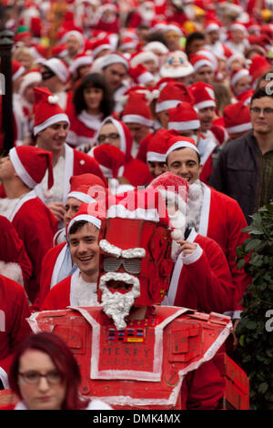 London, UK. 14th of December 2013 Annual Santa Con gathering hits Central London. Every year in December thousands of people dress up as Santa for the annual get together of Santa Con, they walk from various landmarks in London. Credit:  nelson pereira/Alamy Live News Stock Photo