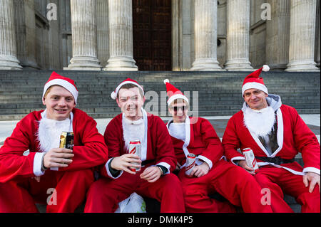 London, UK. 14th December, 2013.  Hundreds of Santas gather on the steps of St Pauls Cathedral before they march off to meet up with groups of other Santas to celebrate the annual Santacon.  Photographer: Gordon Scammell/Alamy Live News Stock Photo