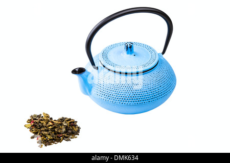 blue pig-iron teapot and green tea isolated on white background Stock Photo