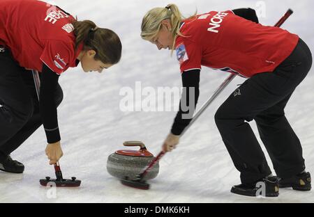 Fuessen, Germany. 14th Dec, 2013. Norwegian curlers Julie Kjaer Molnar (L) and Camilla Holth compete against Germany at the olympic qualification at Arena Fuessen in Fuessen, Germany, 14 December 2013. Photo: KARL-JOSEF HILDENBRAND/dpa/Alamy Live News Stock Photo