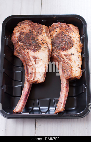 Raw lamb chop ready to cook in plastic tray. Stock Photo