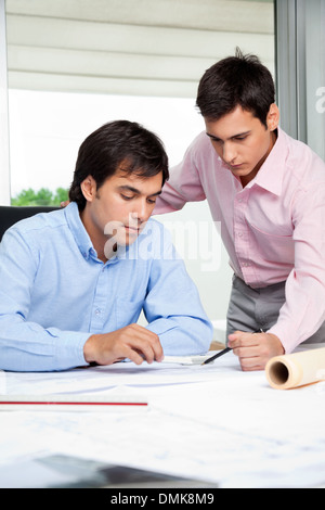 Architects Discussing Work Stock Photo