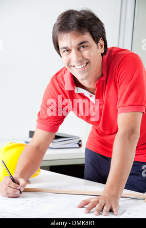 Architect Working on Blueprints Stock Photo