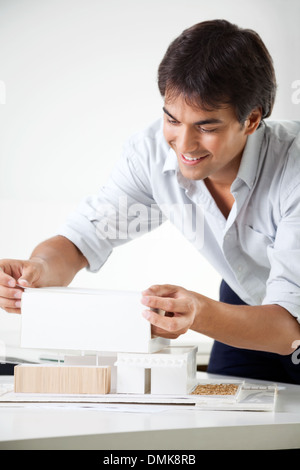 Architect Creating a Model House Stock Photo