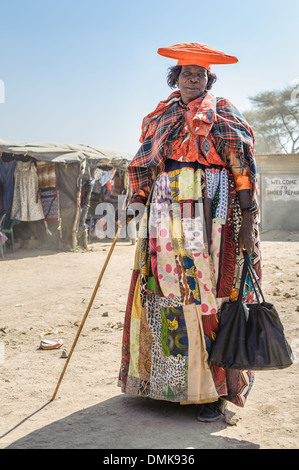 Herero woman dressed with a traditional attire, Opuwo, Namibia, Africa Stock Photo