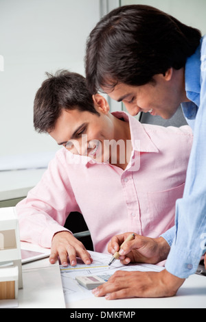 Architects Doing Some Calculations Stock Photo