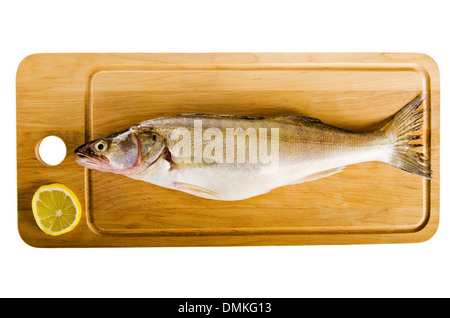 Pike perch on a wooden kitchen board, it is isolated on white Stock Photo