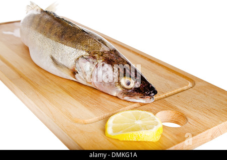 Pike perch on a wooden kitchen board, it is isolated on white Stock Photo