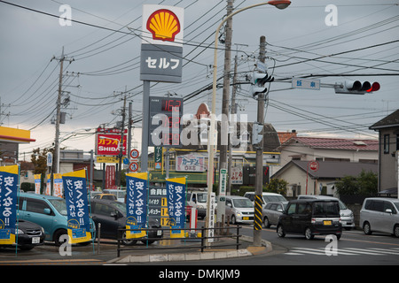 Cars drive past a Shell petrol / gasoline station in Odawara, Tokyo, Japan on November 2013. Stock Photo