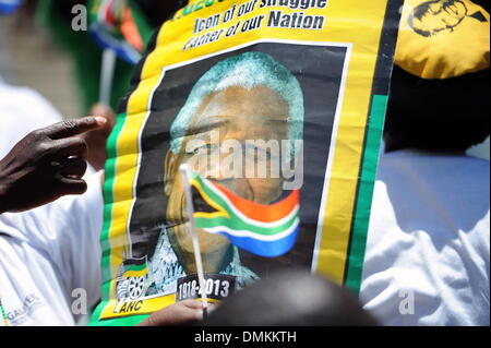 Soweto, South Africa. 15th Dec 2013. Thousands of people gathered to pay their last respects to Nelson Mandela at Orlando Stadium while he was buried in Qunu on December 15, 2013 in Soweto, South Africa. Nelson Mandela passed away on the evening of December 5, 2013 at his home. He is laid to rest at his homestead in Qunu today. (Photo by Gallo Images / Foto24 / Mary-Ann Palmer) Credit:  Gallo images/Alamy Live News Stock Photo