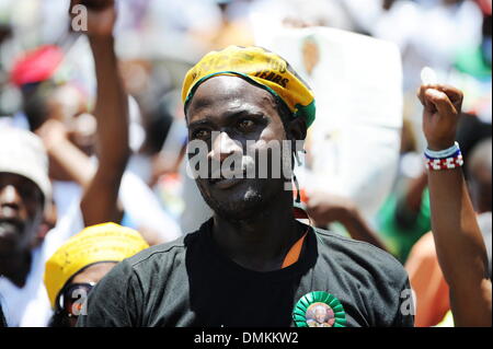 Soweto, South Africa. 15th Dec 2013. Thousands of people gathered to pay their last respects to Nelson Mandela at Orlando Stadium while he was buried in Qunu on December 15, 2013 in Soweto, South Africa. Nelson Mandela passed away on the evening of December 5, 2013 at his home. He is laid to rest at his homestead in Qunu today. (Photo by Gallo Images / Foto24 / Mary-Ann Palmer) Credit:  Gallo images/Alamy Live News Stock Photo