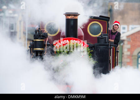 Aberystwyth, Wales, UK.15th Dec 2013.  Santa Claus / Father Christmas making his annual visit to Aberystwyth's Vale of Rheidol narrow gauge steam railway. The 'Santa Specials' packed with children and their parents, run from the old victorian railway station on the two weekends before Christmas.  Credit:  keith morris/Alamy Live News Stock Photo