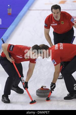 Fuessen, Germany. 14th Dec, 2013. The German curler Christopher Bartsch (L-R), Sven Goldemann and Felix Schulze play during the game for the qualification for the olympics at the Arena in Fuessen, Germany, 14 December 2013. Photo: Karl-Josef Hildenbrand/dpa/Alamy Live News Stock Photo