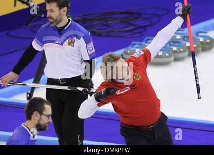 Fuessen, Germany. 14th Dec, 2013. The German curler John Jahr (R) cheers during the game for the qualification for the olympics at the Arena in Fuessen, Germany, 14 December 2013. Photo: Karl-Josef Hildenbrand/dpa/Alamy Live News Stock Photo