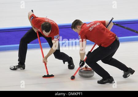 Fuessen, Germany. 14th Dec, 2013. The German curler Felix Schulze (L) and Christopher Bartsch play during the game for the qualification for the olympics at the Arena in Fuessen, Germany, 14 December 2013. Photo: Karl-Josef Hildenbrand/dpa/Alamy Live News Stock Photo