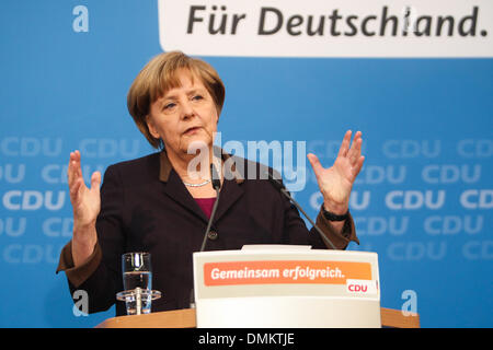 Berlin, Germany. 15th Dec, 2013. German Chancellor Angela Merkel speaks during a press conference in Berlin, Germany, on Dec, 15, 2013. Merkel's conservatives presented their picks for cabinet ministers on Sunday as the chancellor will be sworn in next week for a third term, heading a grand coalition with the Social Democratic Party (SPD). Credit:  Zhang Fan/Xinhua/Alamy Live News Stock Photo