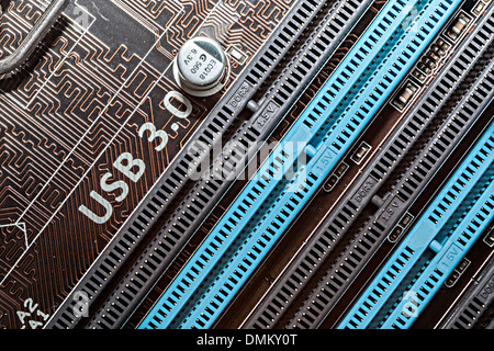 Computer motherboard with USB 3.0 written near slots for memory chips Stock Photo