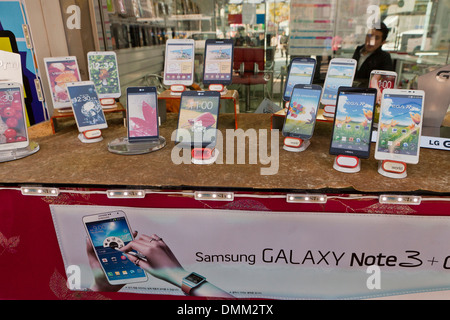 Mobile phone store window display - Busan, South Korea Stock Photo - Alamy