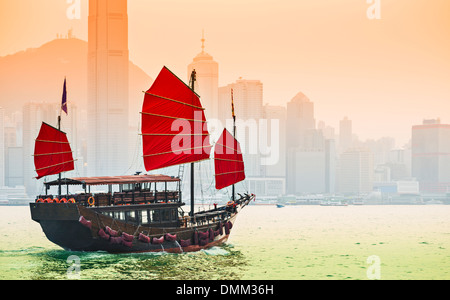 Junk Ship sails in Victoria Harbor in Hong Kong, China. Stock Photo