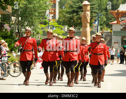 Royal Canadian Mounted Police officers parade in ceremonial red serge ...