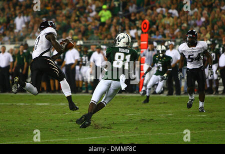 15 October 2009: Cincinnati cornerback Aaron Webster #17 intercepts the ball from South Florida wide receiver Dontavia Bogan #81 during the first half of the South Florida versus Cincinnati college football game held at Raymond James Stadium in Tampa, FL. (Credit Image: © Southcreek Global/ZUMApress.com) Stock Photo