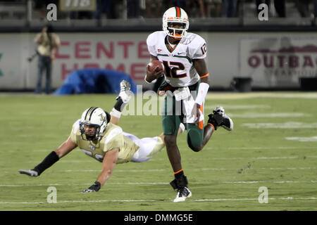 16 October 2009: Miami (FL) quarterback Jacory Harris (12) runs for a first down between the UCF Knights and the Miami Hurricanes  at Brighthouse Networks Stadium in Orlando, FL. Miami defeated UCF 27-7..Mandatory Credit: Donald Montague / Southcreek Global  (Credit Image: © Southcreek Global/ZUMApress.com) Stock Photo