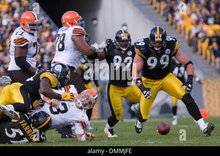 18 October 2009:  Cleveland Browns quarterback Derek Anderson (3) fumbles the football as he is being sacked by Pittsburgh Steelers James Farrior (51) and Lawrence Timmons (94) and Steelers Brett Keisel (99) is about to recover the ball during the NFL football game between the Cleveland Browns and Pittsburgh Steelers at Heinz Field in Pittsburgh, Pennsylvania.  The Steelers defeate Stock Photo