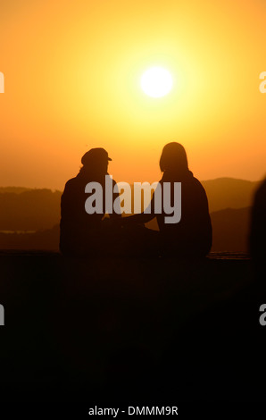 Lovers sitting on the wall at Skala du Port close to Medina Essaouira Morocco Stock Photo