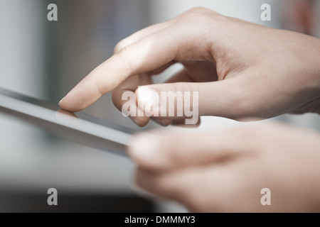 Close-up view on the human hands using digital tablet Stock Photo
