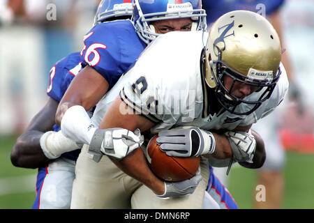 4 September 2009:   Northern Colorado tight end Andrew Emmerling (89) is brought down by Kansas cornerback Justin Thornton (46) and Kansas defensive end Maxwell Onyegbule (90) during game action in the first half. The Kansas Jayhawks defeated the Northern Colorado Bears 49-3 at Memorial Stadium. (Credit Image: © Southcreek Global/ZUMApress.com) Stock Photo